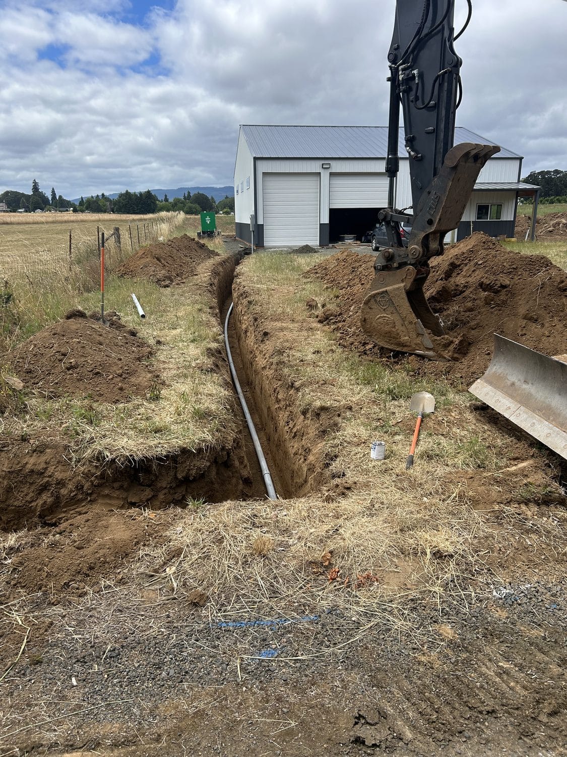 Utility trench run out to a new shop building.