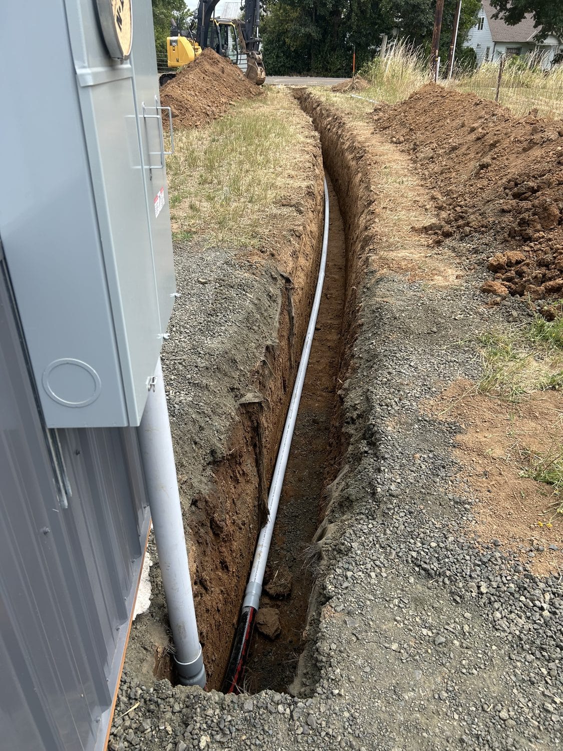 Line and conduit bedded in before backfill.